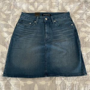 Calvin Klein navy denim skirt. Never worn. Size 6